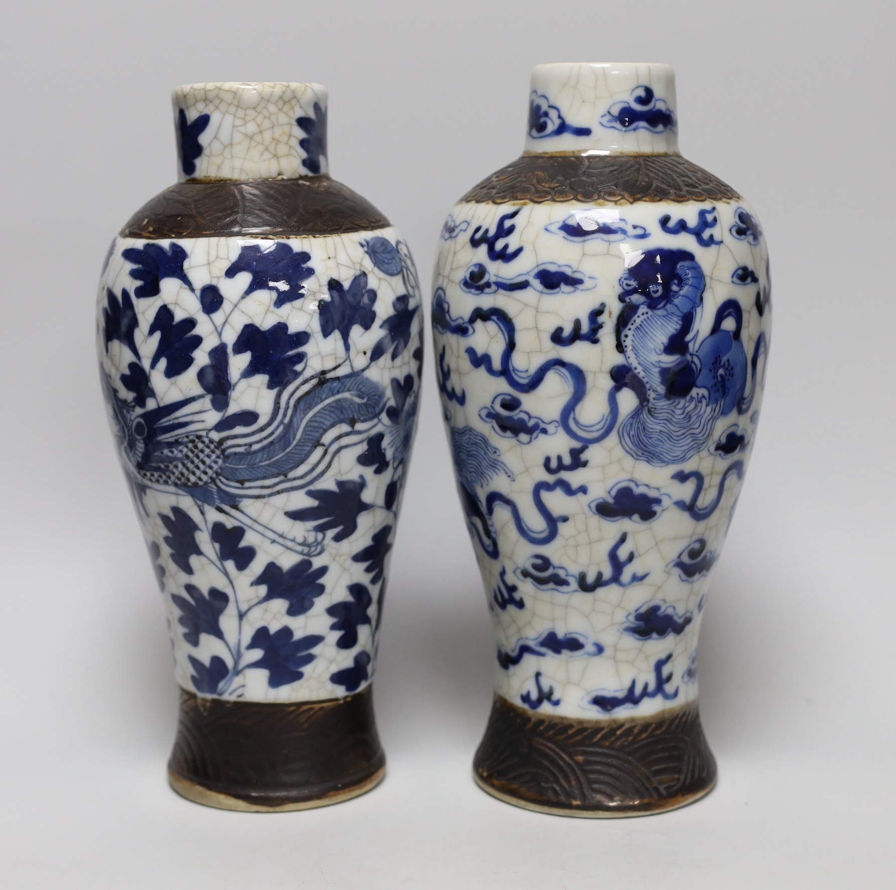A pair of 19th century Chinese crackleglaze blue and white vases, 27cm